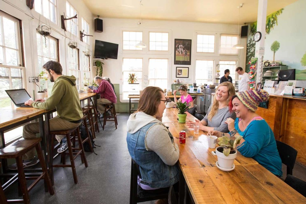 Travellers enjoy the cafe at HI San Francisco Fisherman’s Wharf Hostel, where a private room costs less than US$100 on some nights and the rate includes Wi-fi, breakfast and luggage storage. More travellers are considering hostels as alternatives to hotels and Airbnbs.