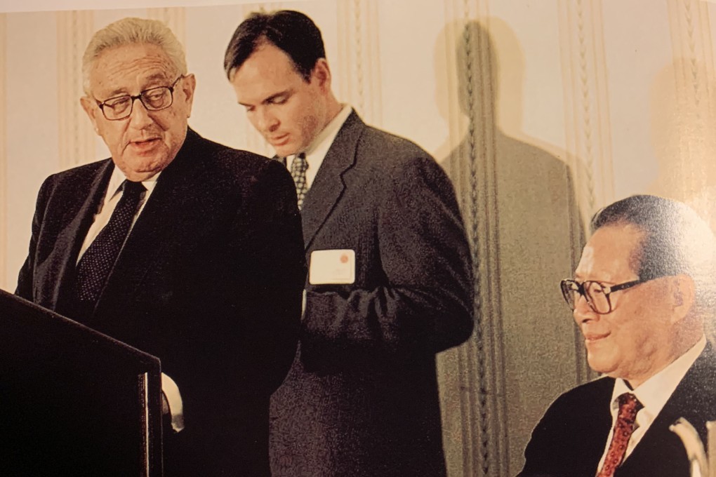 Robert Daly, pictured interpreting for Henry Kissinger and Jiang Zemin in 1997, said Kissinger was “one of the last giants”. Photo: Supplied by Robert Daly