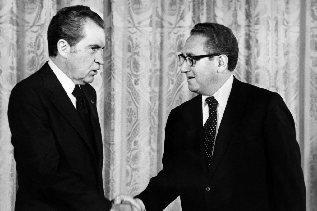 A 1973 file photo shows US President Richard Nixon (left) shaking hands with Secretary of State Henry Kissinger in Washington. Photo: AFP