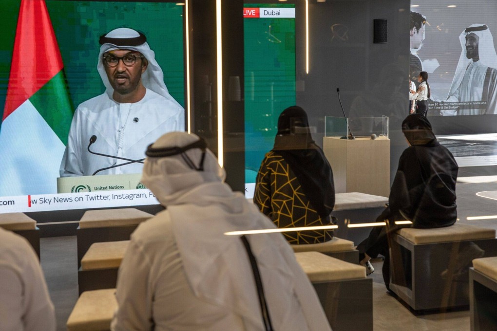Attendees watch a broadcast of Cop28 president Sultan Ahmed al-Jaber. Cop28 president Sultan Ahmed al-Jaber proposed embracing the continued use of fossil fuels. Photo: Bloomberg