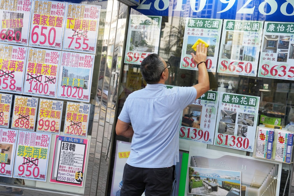 Property listings are displayed on the window of a real estate agency in Quarry Bay. Photo: Elson Li