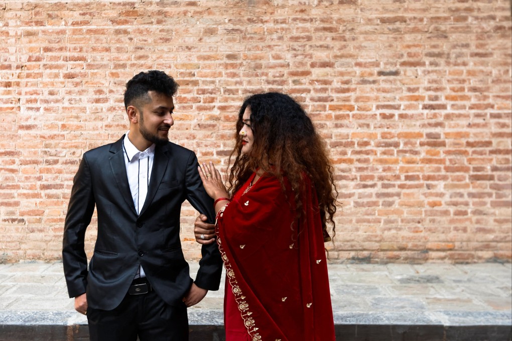 Ram Bahadur (Maya) Gurung, 36, who was born male but identifies as female, and Surendra Pandey, 26, who was born and identifies as male, at their press conference after they registered Nepal’s first same-sex marriage. Photo: Reuters