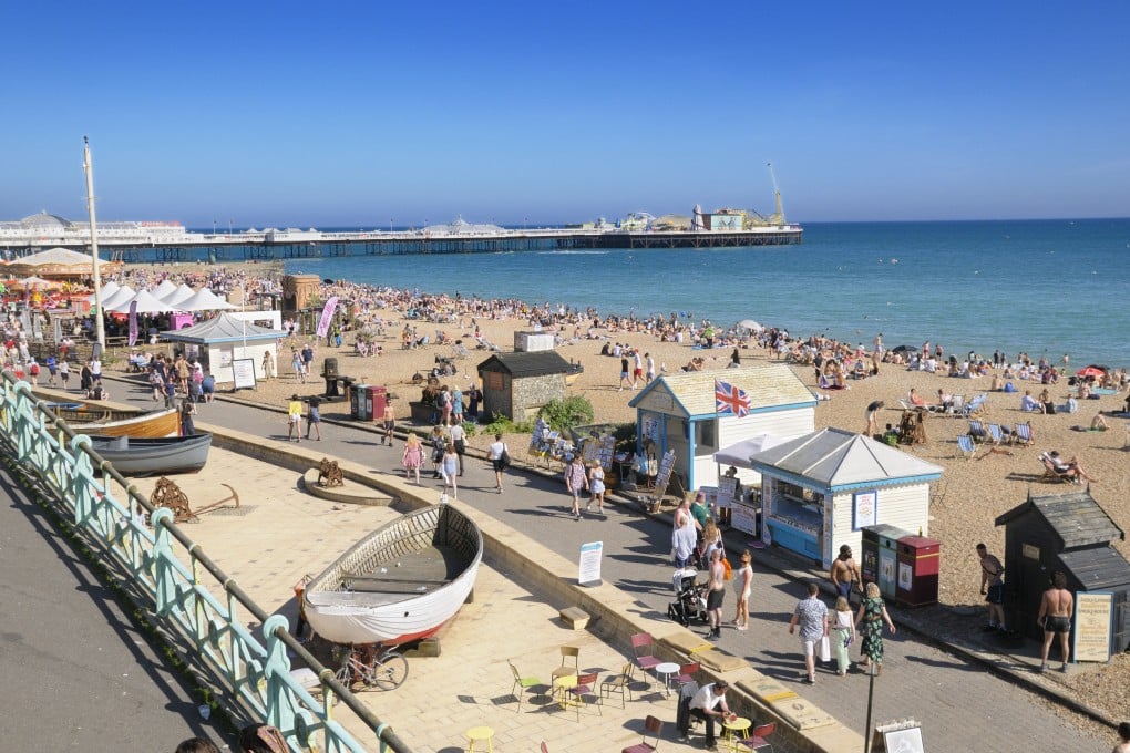 A rare sunny summer’s day at the beach in Brighton, on England’s south coast. Photo: Getty Images