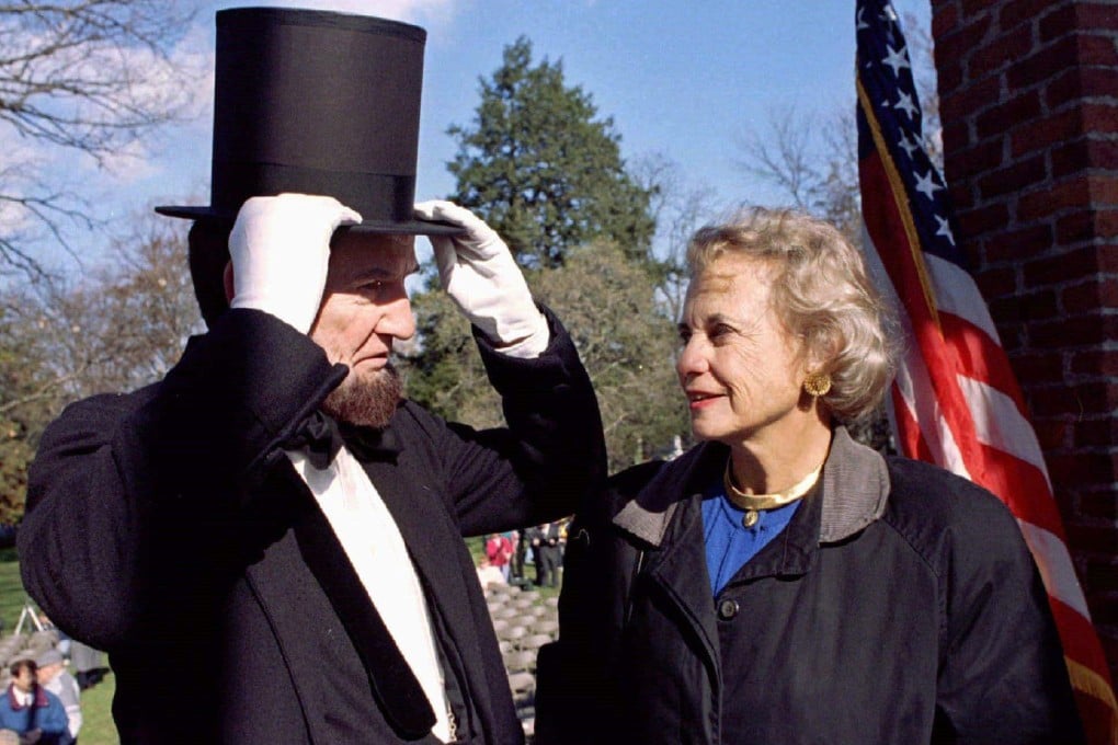 Supreme Court Justice Sandra Day O’Connor looks on as James A. Getty portrays President Abraham Lincoln at a ceremony at Gettysburg National Cemetery in 1996. Photo: Reuters