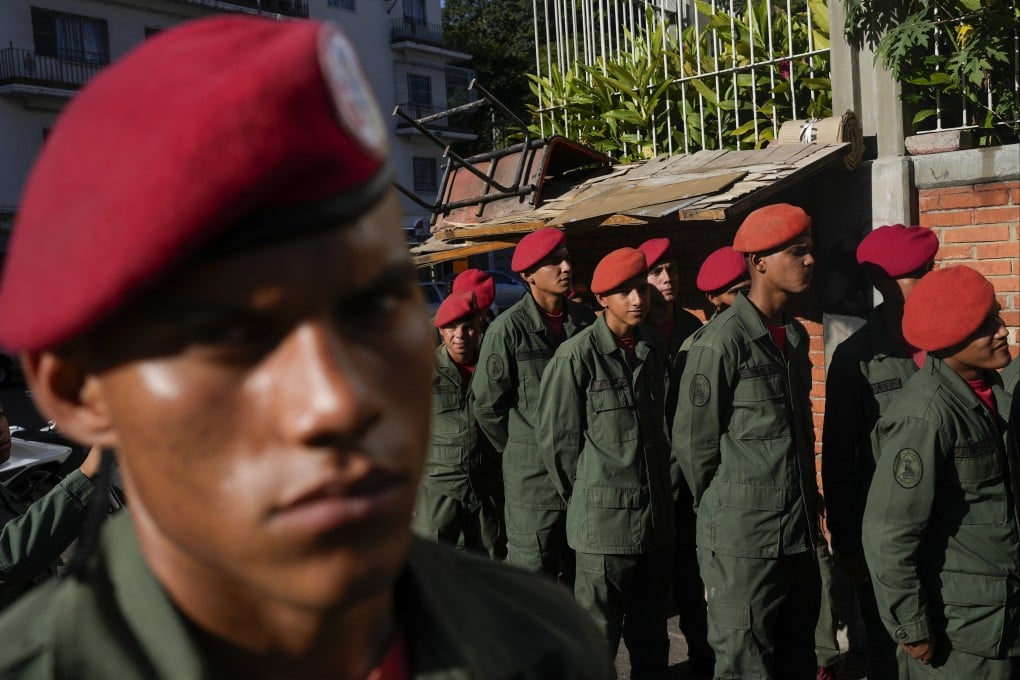 Members of the Presidential Guard line up to vote in the referendum. Photo: AP