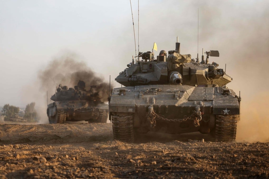 Israeli military tanks near the border with the Gaza Strip on Sunday. Photo: AFP