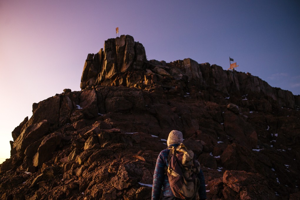 Point Lenana, Mount Kenya’s third highest peak, at dawn. The remoteness of its peaks has traditionally kept tourism down and pollution at bay. Now they have become more accessible, and plans to make it easier still to reach them threaten to leave it as dirty as nearby Kilimanjaro. Photo: Kang-Chun Cheng