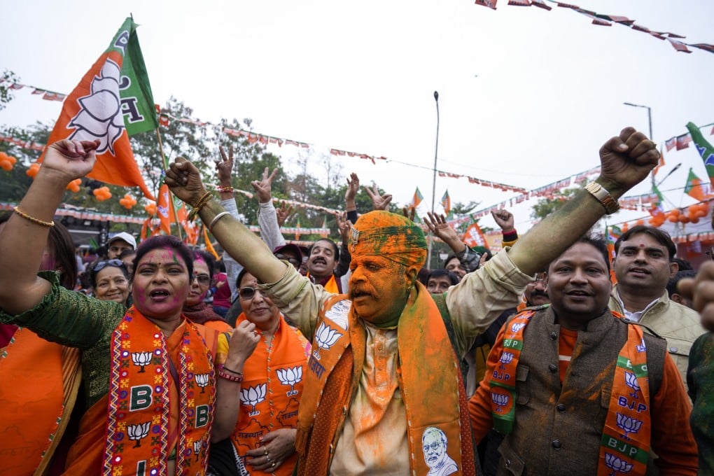 Supporters of India’s ruling BJP celebrate early leads for the party in Rajasthan state elections in Jaipur. Photo: AP