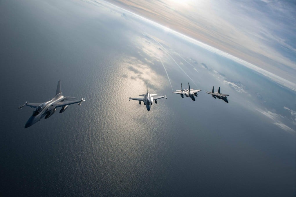 Fighter jets of the United States and Philippines fly over the South China Sea during joint maritime and air patrols between the two countries on November 21, 2023. Photo: AFP