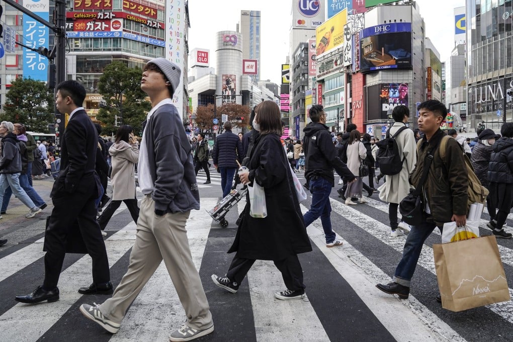 Pedestrians at a crosswalk in Tokyo. A survey found Japan’s proficiency in spoken English has declined ‘significantly’. Photo: EPA-EFE