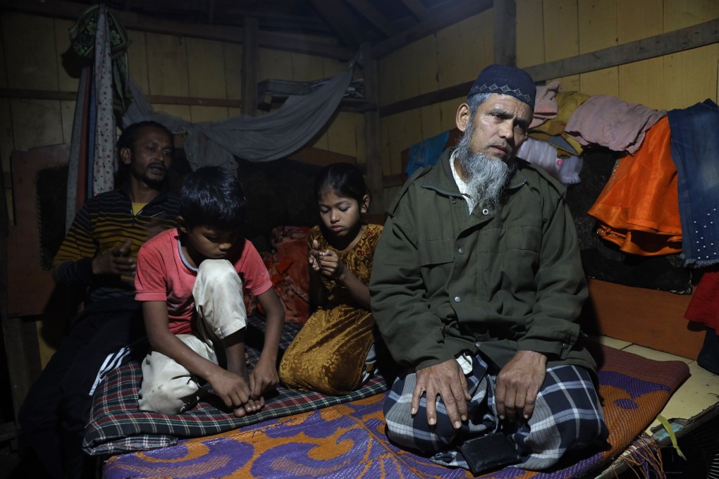 Mukhtayar Ahmad with his children in his rented makeshift shanty in the Narwal area of Jammu. Photo: Kamran Yousuf