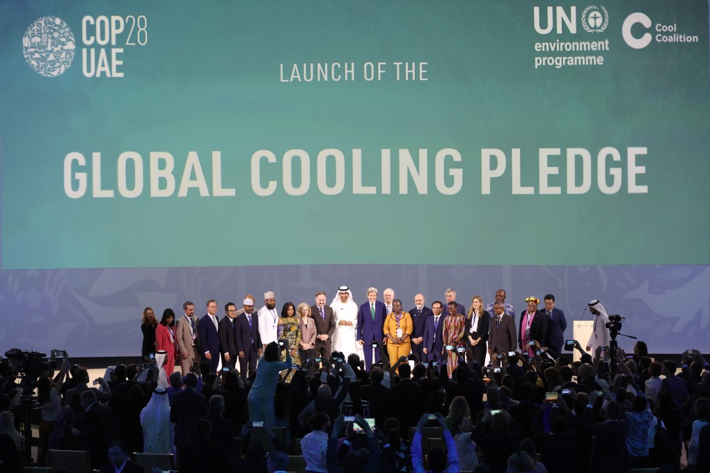 Cop28 president Sultan Al Jaber, US climate envoy John Kerry and other attendees pose for a group photo after the launch of the Global Cooling Pledge in Dubai on Tuesday. Photo: EPA-EFE