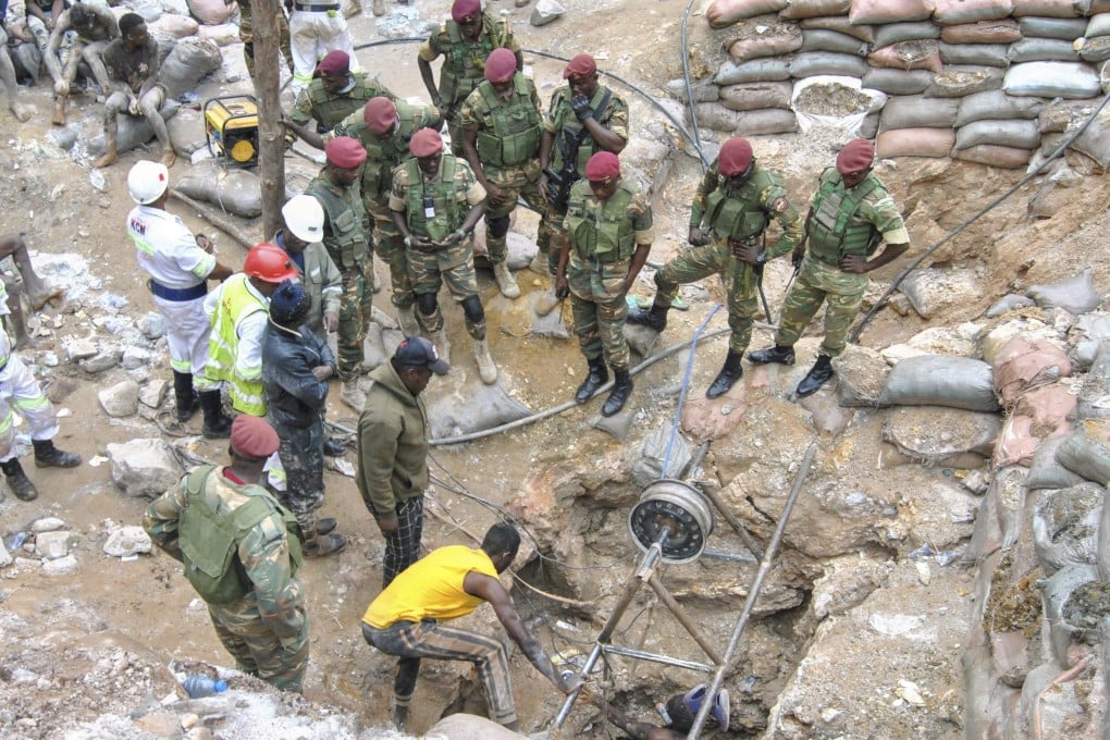 Zambian Army special forces officers follow the rescue operation of miners. Photo: AP