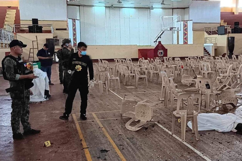 Officers investigate the scene of an explosion that occurred during a Catholic Mass in Marawi, Philippines. Photo: Lanao Del Sur Provincial Government/Handout via Reuters