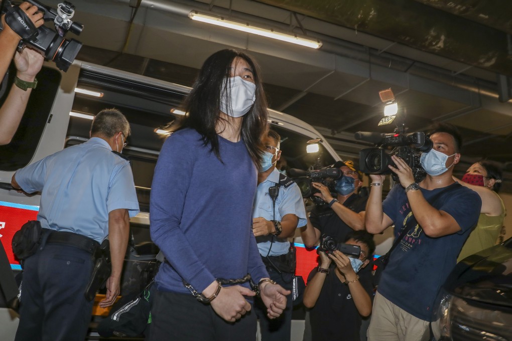 Tsang Chi-kin is escorted by police officers for a court appearance last year. Photo: Yik Yeung-man