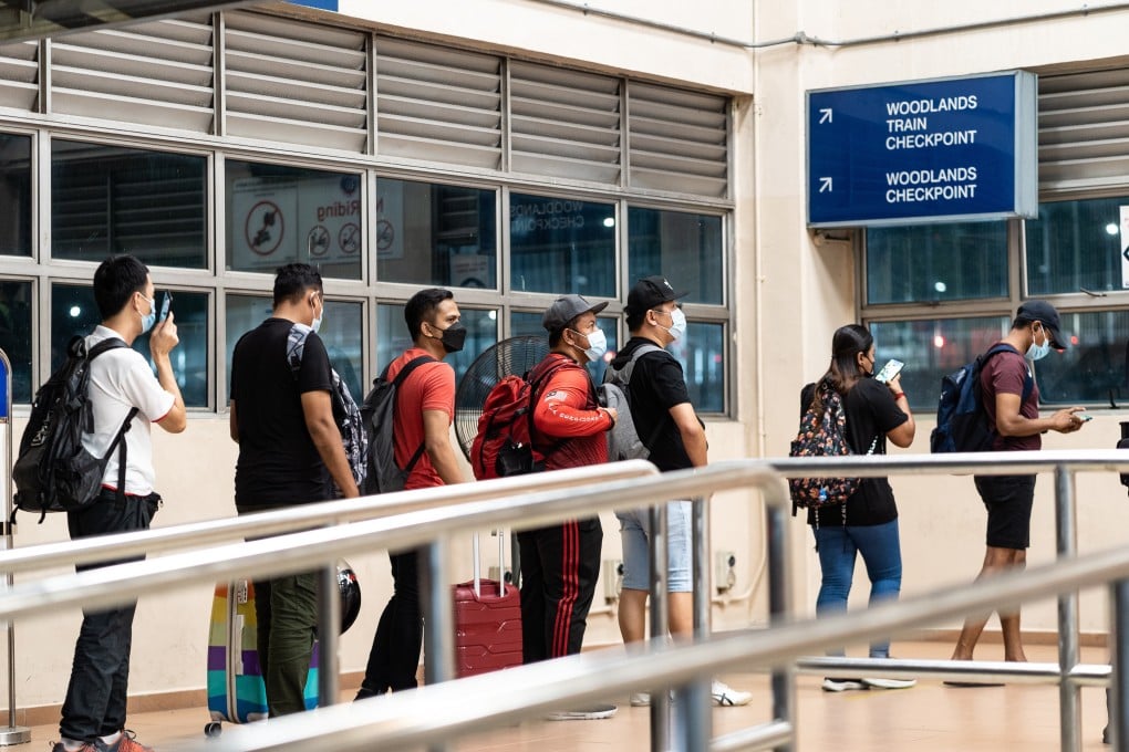 Travellers queue up at Woodlands Checkpoint to cross the Singapore-Malaysia border in 2022. Photo: Anadolu Agency via Getty Images