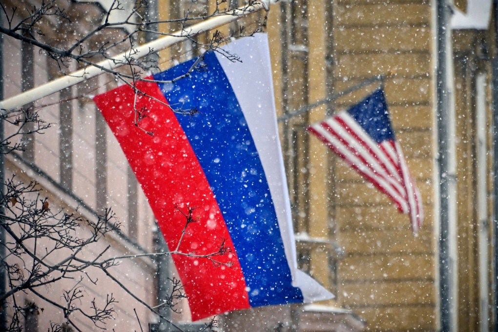 A Russian flag flies next to the US embassy building in Moscow in November. Photo: AFP