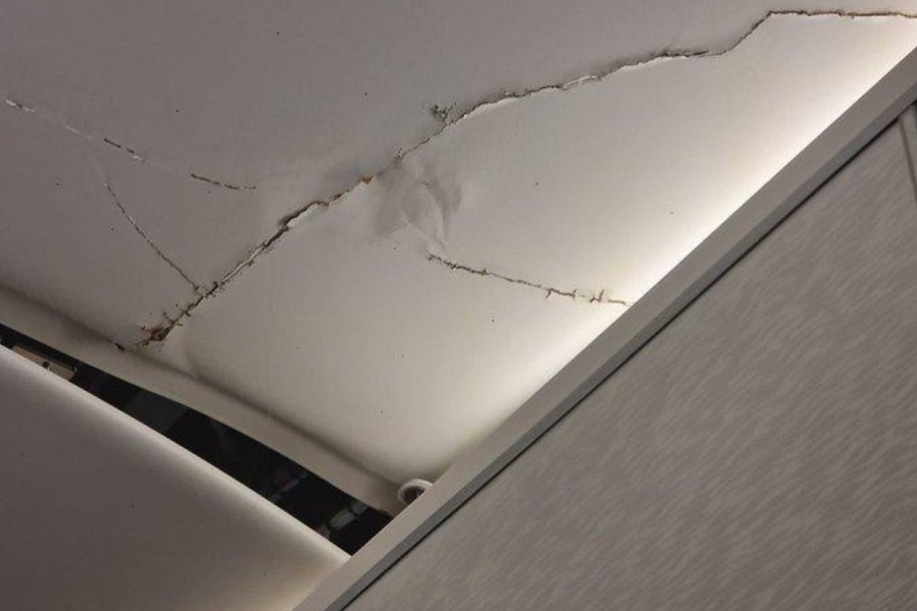 A social media user said they twice hit the Emirates flight’s ceiling, which was left cracked. Photo: X/MattRPD