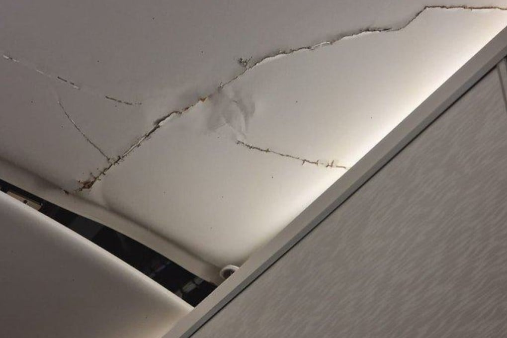 A social media user said they twice hit the Emirates flight’s ceiling, which was left cracked. Photo: X/MattRPD