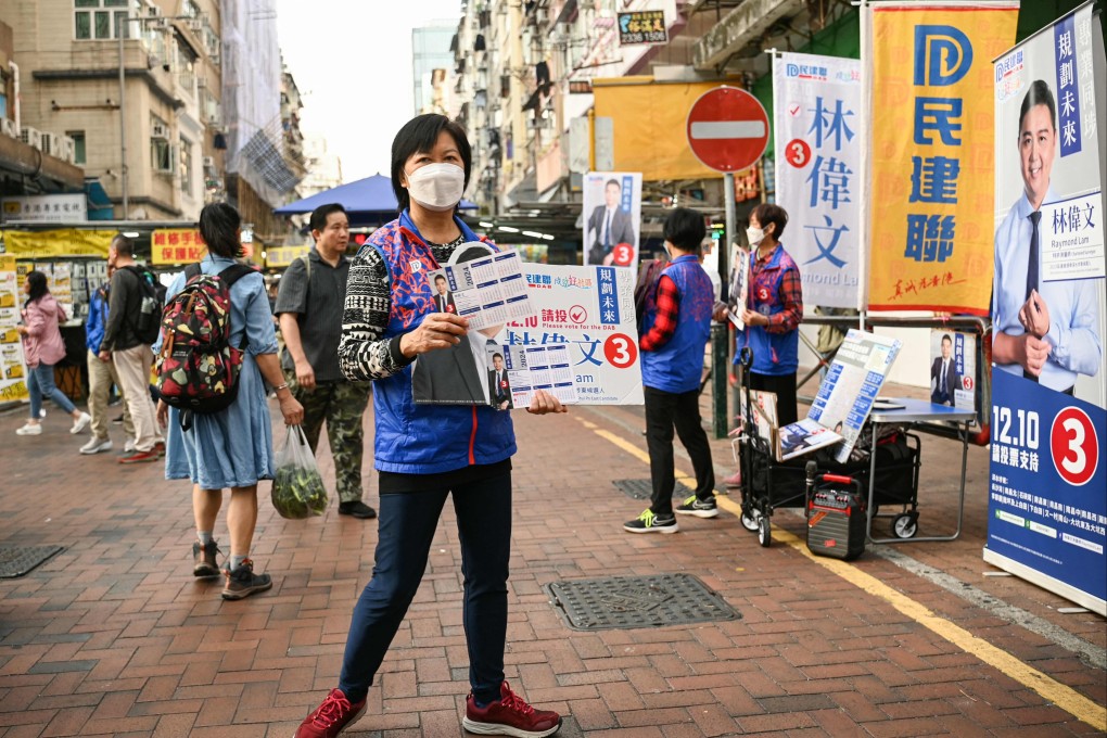 Supporters of candidates in the Hong Kong district council election campaign for public support on December 5. Photo: AFP