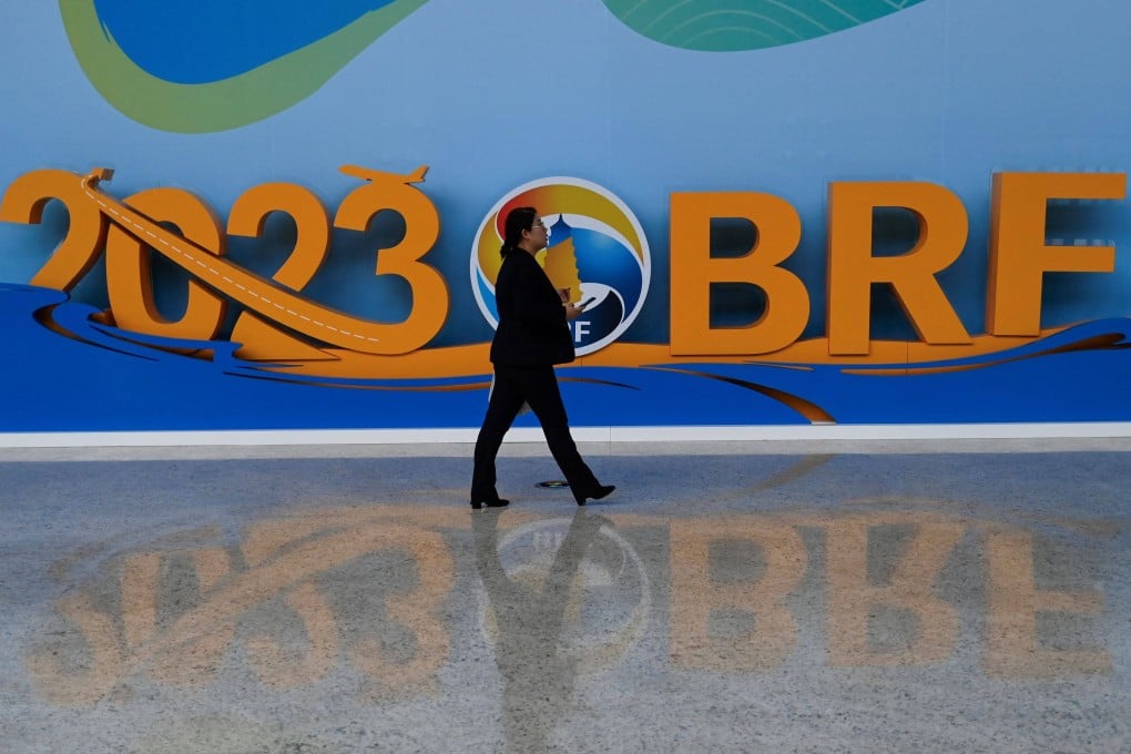 A woman walks in the venue of the Belt and Road forum in Beijing in October. Italy has withdrawn from the China-led investment plan, four years after becoming the only G7 nation to sign up. Photo: AFP