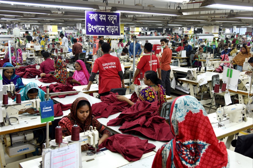 Workers at a garment factory in Dhaka, Bangladesh. The heavily polluting fashion industry has pledged to reach net-zero carbon emissions by 2050, but experts say change will require flexibility and funding from big brands to create cleaner production lines. Photo Getty Images