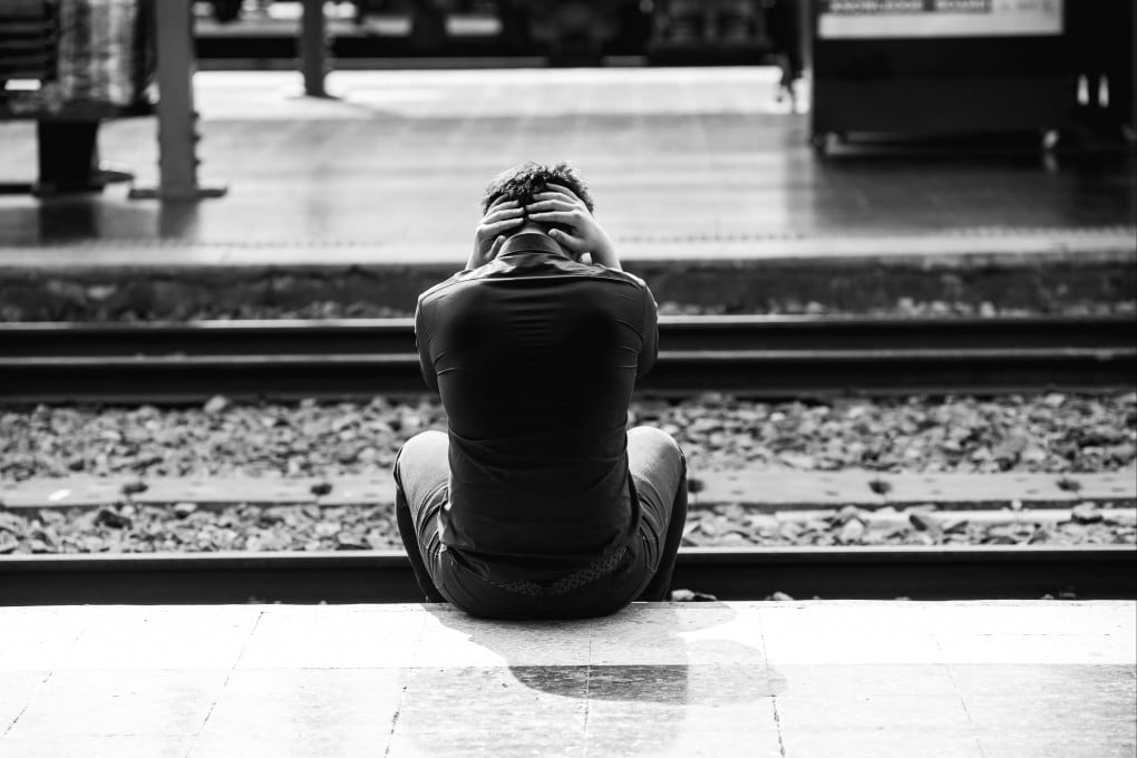 Depressed young man holding his head in hand at train station. Around 458,000 people were killed intentionally, higher than the 400,000 to 450,000 recorded every year since researchers started collating the data in 2000, according to the UN report. Photo: Shutterstock
