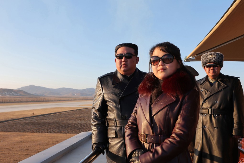 North Korean leader Kim Jong-un (left) and his daughter observing a demonstration flight as they visit the Korean People’s Army’s 1st Army Division Flight Regiment to commemorate “Aviation Day” on November 30. Photo: KCNA/dpa