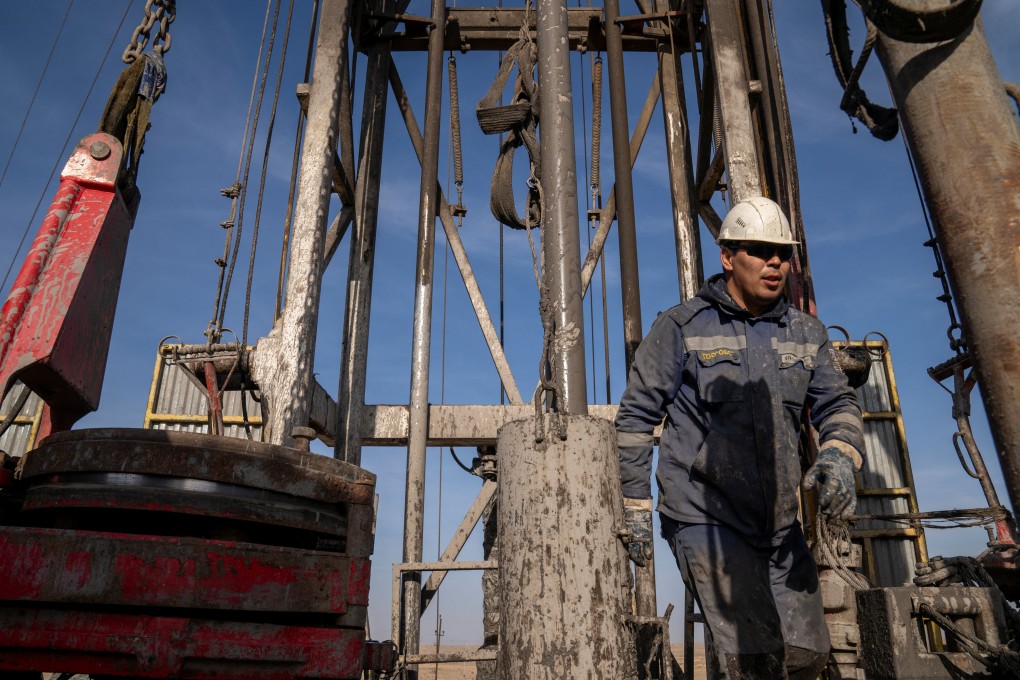 An oil and gas industry worker operates a drilling rig at a field in the Mangystau region, Kazakhstan on November 13. Photo: Reuters
