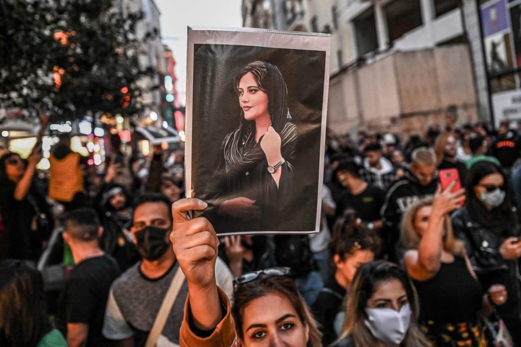 A protester holds a portrait of Mahsa Amini during a demonstration in Istanbul in September 2022. Photo: AFP