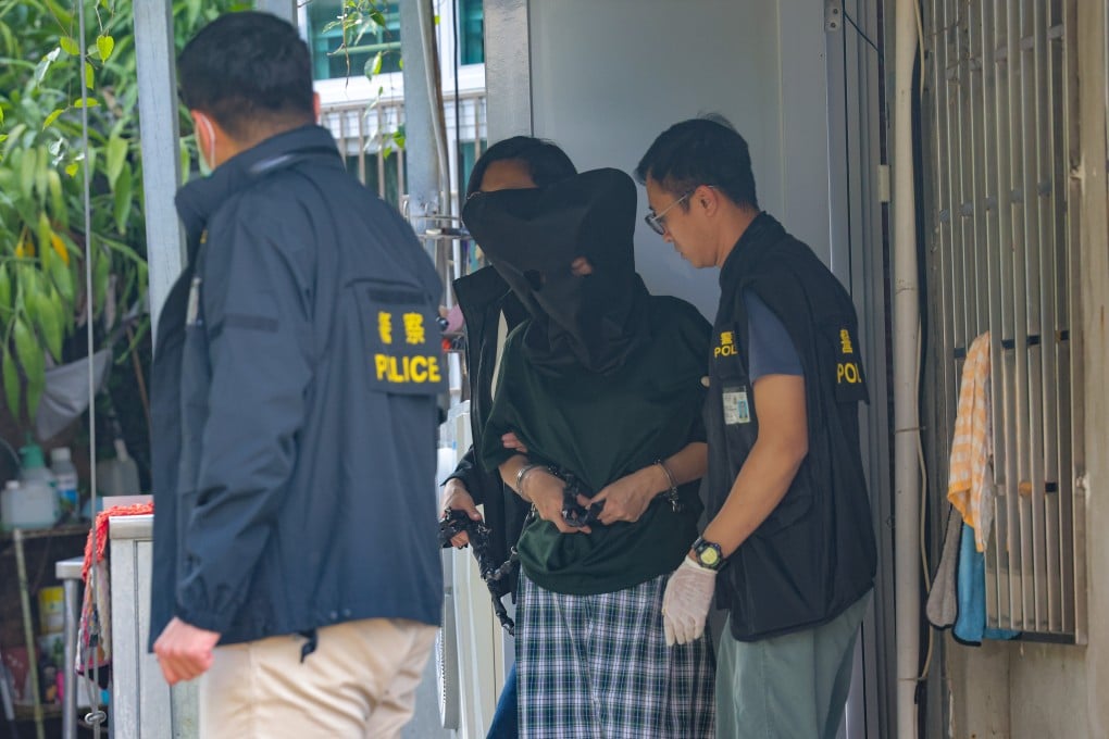 Police escorted a 52-year-old woman back to her home in Chai Kek Village to reconstruct the crime scene. The woman is suspected of murdering her husband. Photo: Jelly Tse