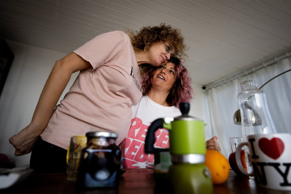 Chiara, right, and her pregnant partner Christine, at their apartment in Rome. Photo: AFP