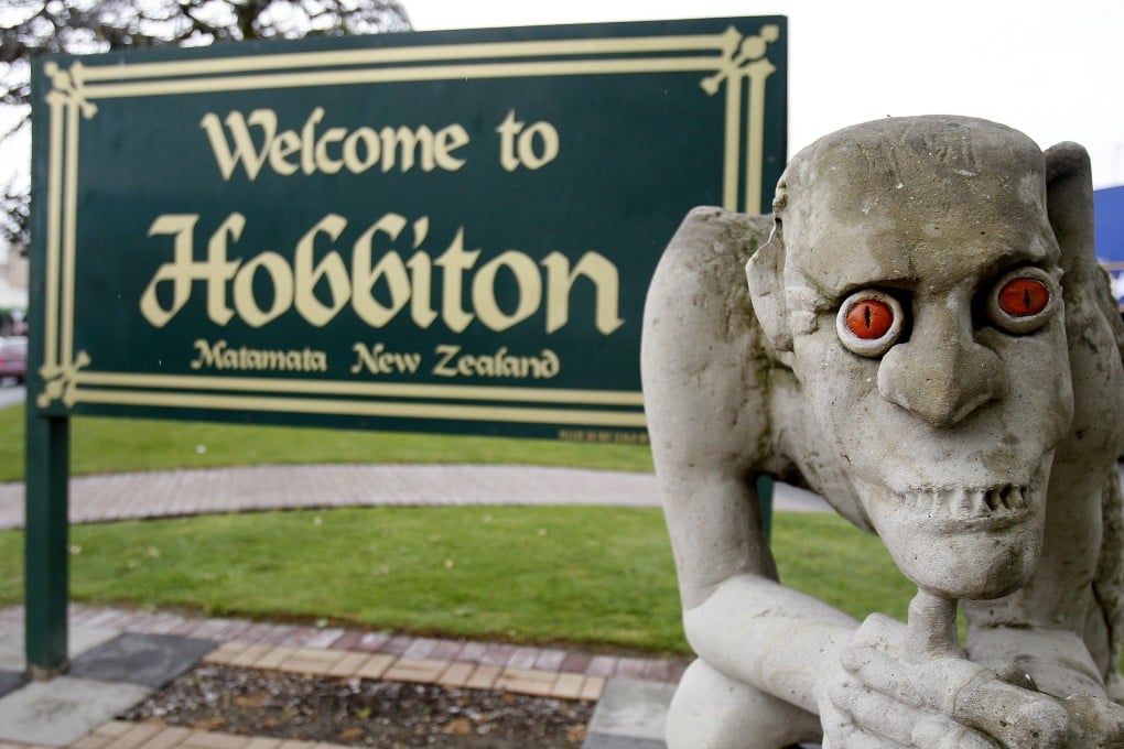 A sculpture of Gollum, the villainous “Lord of the Rings” hobbit, stands in front of a welcome sign in Hobbiton Town, Matamata, New Zealand. Photo: AP