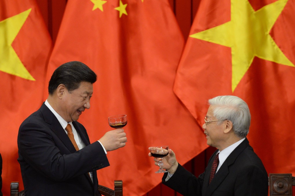 Chinese President Xi Jinping’s trip to Hanoi follows a visit to Beijing last year by Vietnam’s Communist Party chief Nguyen Phu Trong (right). They pledged to take relations to a new level. Photo: AFP
