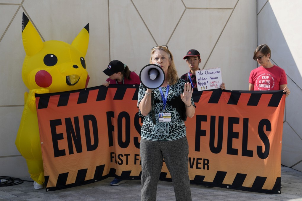 A group of activists demonstrate against fossil fuels at the Cop28 UN climate summit on Sunday in Dubai, UAE. Photo: AP