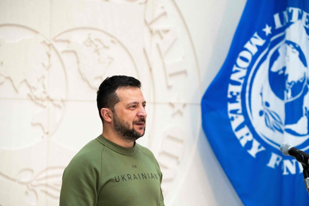 Ukrainian President Volodymyr Zelensky listens to International Monetary Fund (IMF) Director Kristalina Georgieva speak to the press after talks at IMF headquarters in Washington, DC, on December 11, 2023. Photo: AFP