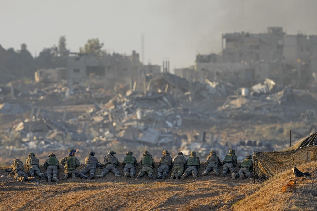 Israeli soldiers take positions near the Gaza Strip border, in southern Israel. Photo: AP
