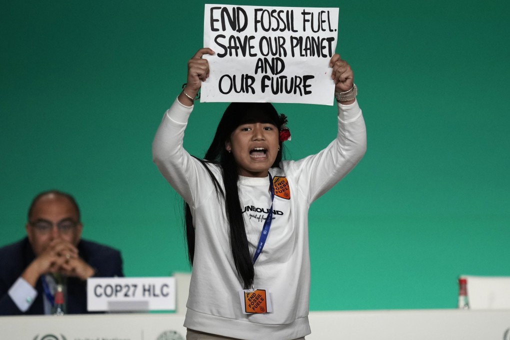 Climate activist Licypriya Kangujam came on stage  at the Dubai summit to protest against the use of fossil fuels, before being ushered away. Photo: AP