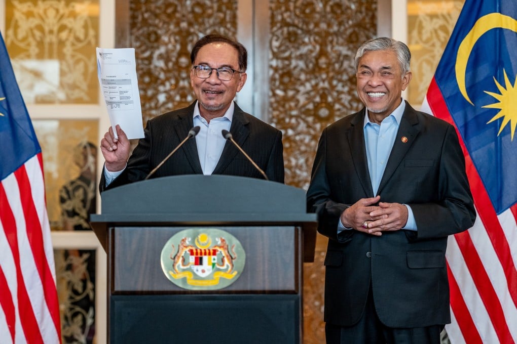 Malaysian Prime Minister Anwar Ibrahim announces his cabinet reshuffle on Tuesday as Deputy Prime Minister Ahmad Zahid Hamidi looks on. Photo: Prime Minister’s Office of Malaysia