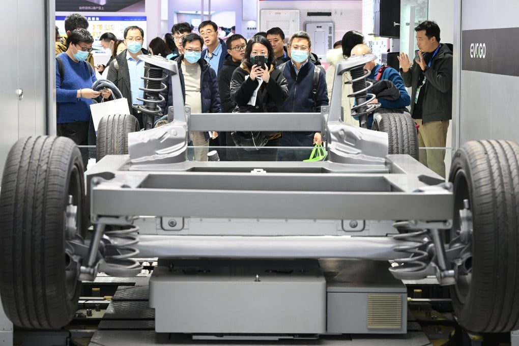Visitors look at a power-battery swap system for new-energy vehicles at a booth in the smart vehicle section of the China International Supply Chain Expo in Beijing on December 1. Photo: Xinhua