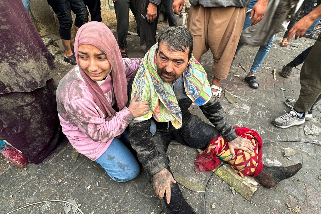 Palestinians react following an Israeli strike in Rafah in the southern Gaza Strip on Tuesday. Photo: Reuters