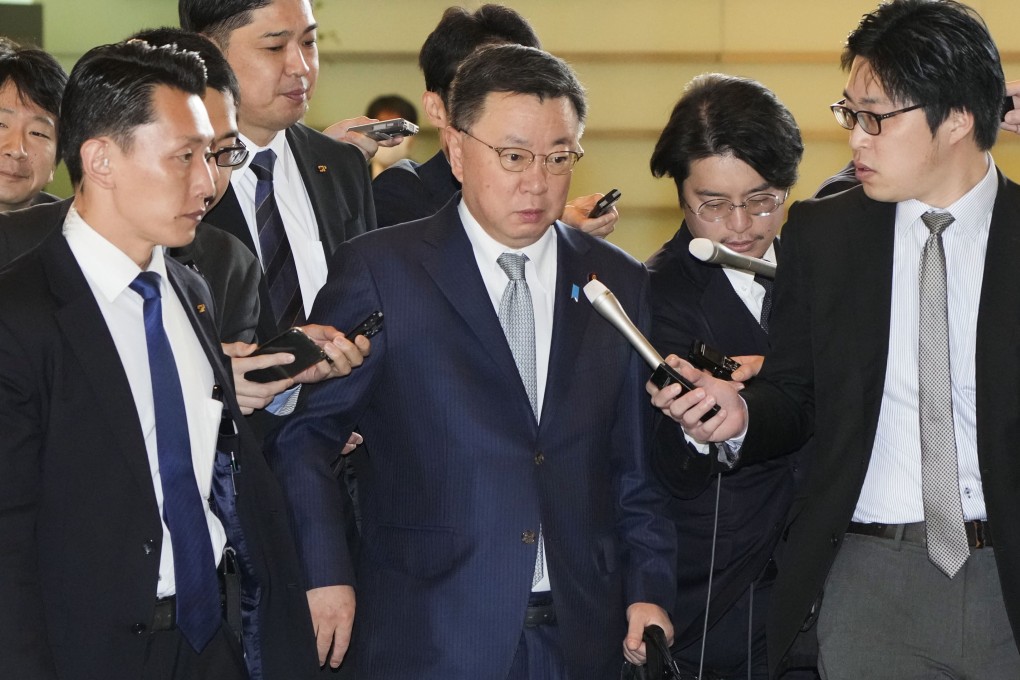 Japanese Chief Cabinet Secretary Hirokazu Matsuno surrounded by reporters upon arriving at the premier’s office in Tokyo on Thursday, amid a corruption scandal involving himself and other ruling LDP lawmakers. Photo: Kyodo