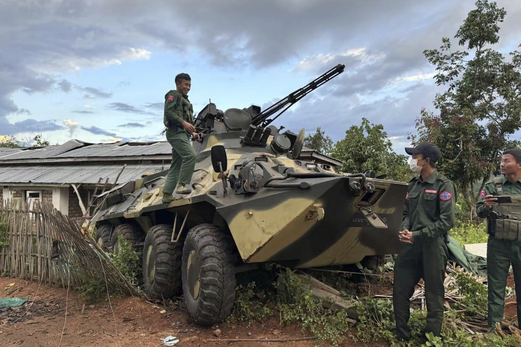 Members of an ethnic armed forces group, one of the three militias known as the Three Brotherhood Alliance, check an army armoured vehicle the group allegedly seized from Myanmar’s army outpost on a hill in Hsenwi township in Shan state last month. Photo: The Kokang online media via AP