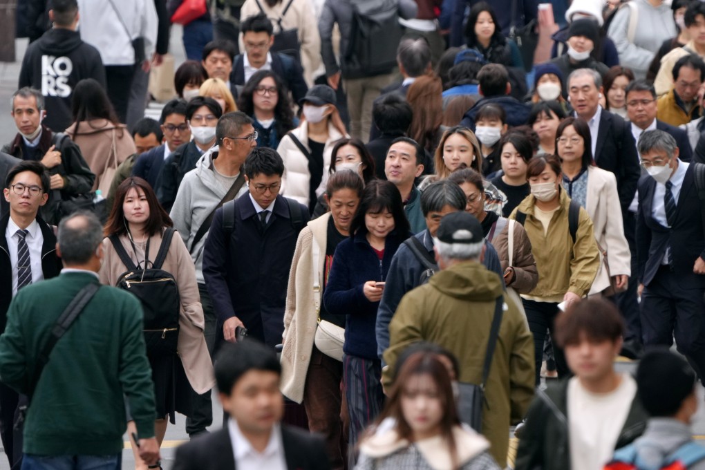 Pedestrians commute on Shinjuku street in Tokyo. Japan would need 6.7 million foreign workers by 2040 to meet its own projected economic growth rates, a 2022 report showed. Photo: EPA-EFE