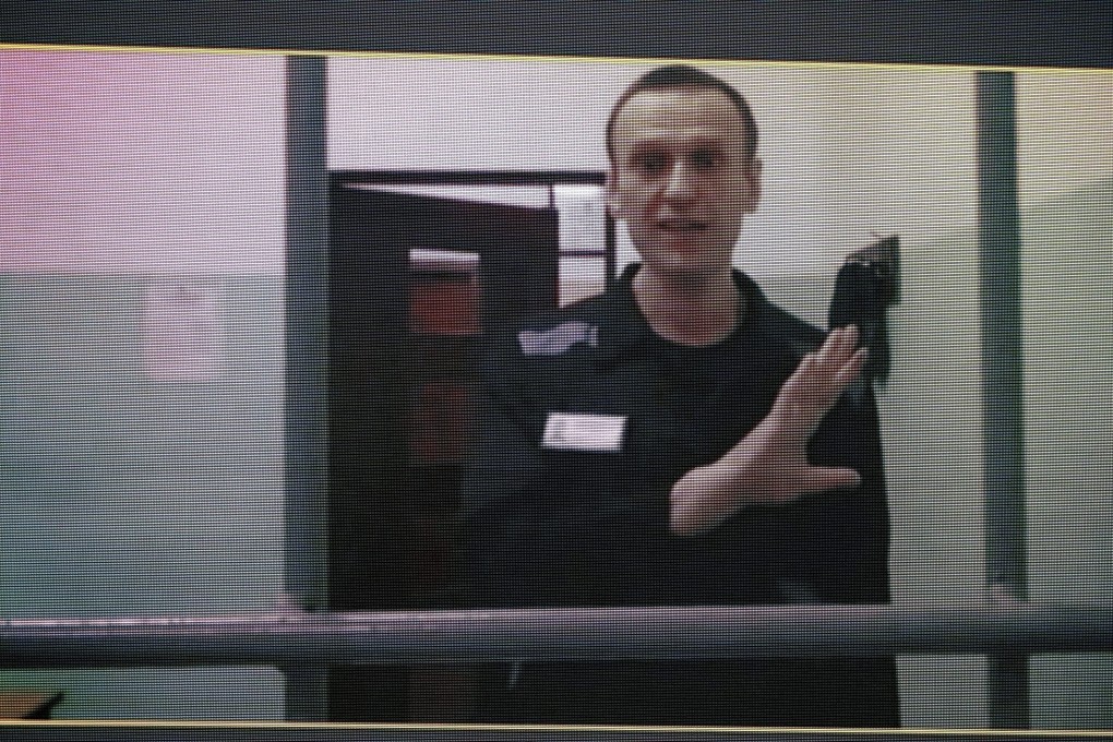 Russian opposition leader Alexei Navalny, seen on a TV screen as he appears in a video link provided by the Russian Federal Penitentiary Service from the colony in Melekhovo, Vladimir region, during a court hearing. Photo: AP