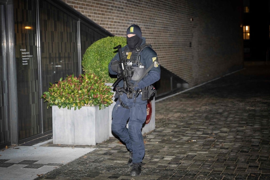 A Danish police officer stands guard in front of the court in Frederiksberg, Copenhagen, on Thursday. Photo: AFP