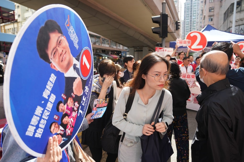 Political parties canvass voters for the district council election at North Point on December 10. Photo: Sam Tsang