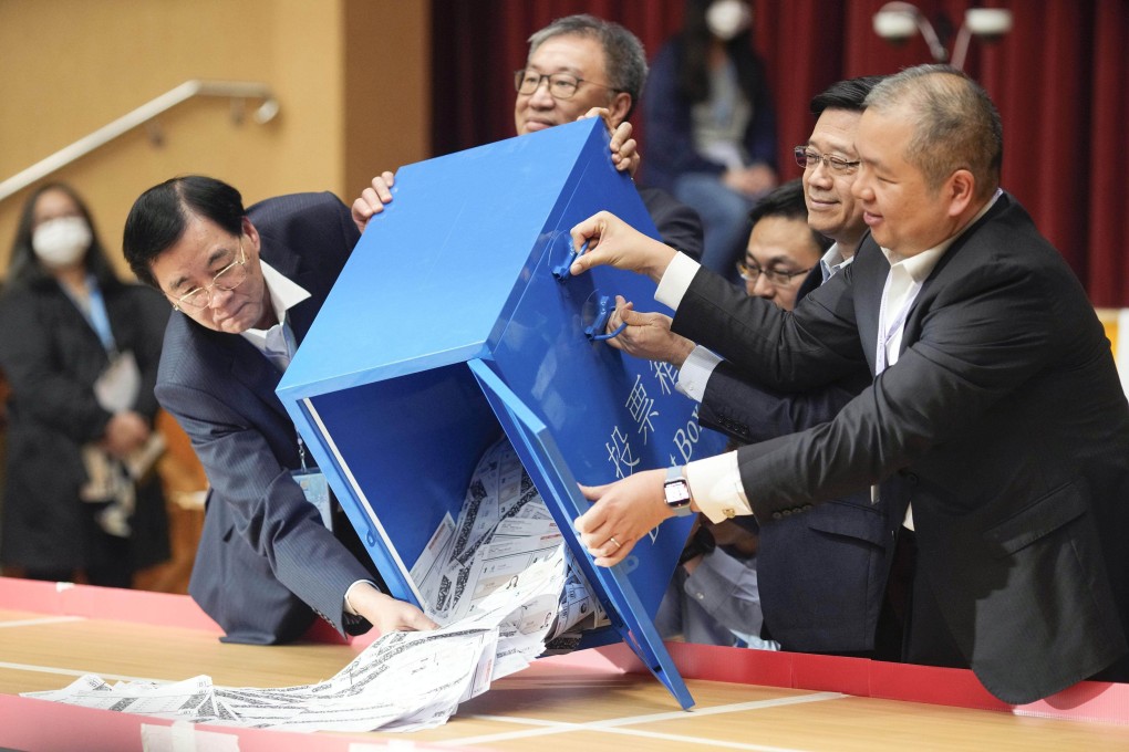 Chief Executive John Lee and other officials open a ballot box after Hong Kong’s district council election was held the previous day. Photo: Kyodo