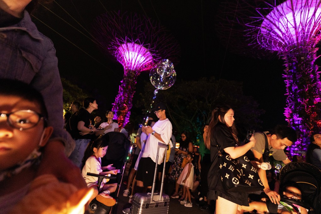 People look at the light show at Christmas Wonderland Festival at Gardens by the Bay in Singapore on December 10. Photo: EPA-EFE