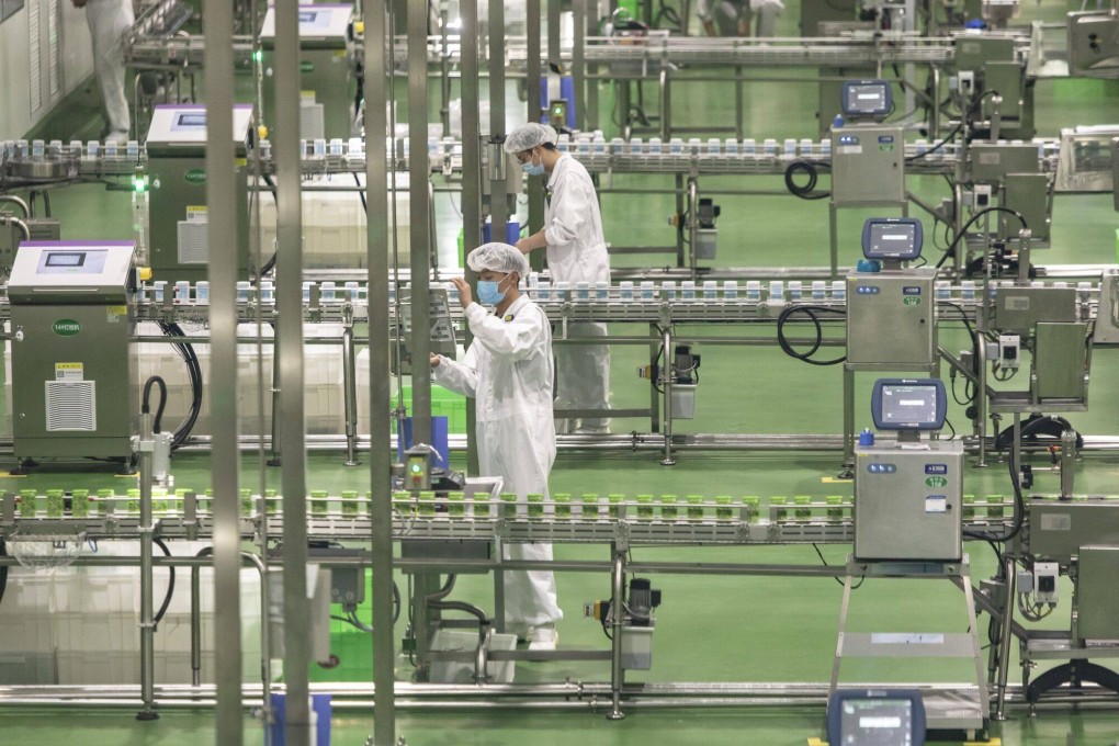 Dairy goods move along production lines at a production plant in Hohhot, Inner Mongolia autonomous region, on May 29. Concerns about the transparency of China’s economic data have intensified in recent years, leaving job-seekers, employers and economic observers straining to build a reliable plan for the future. Photo: Bloomberg